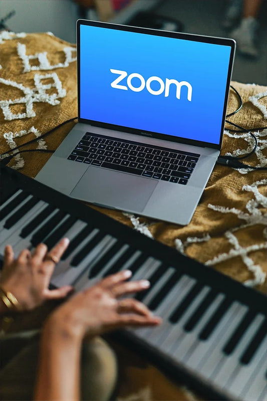 Person playing piano on zoom
